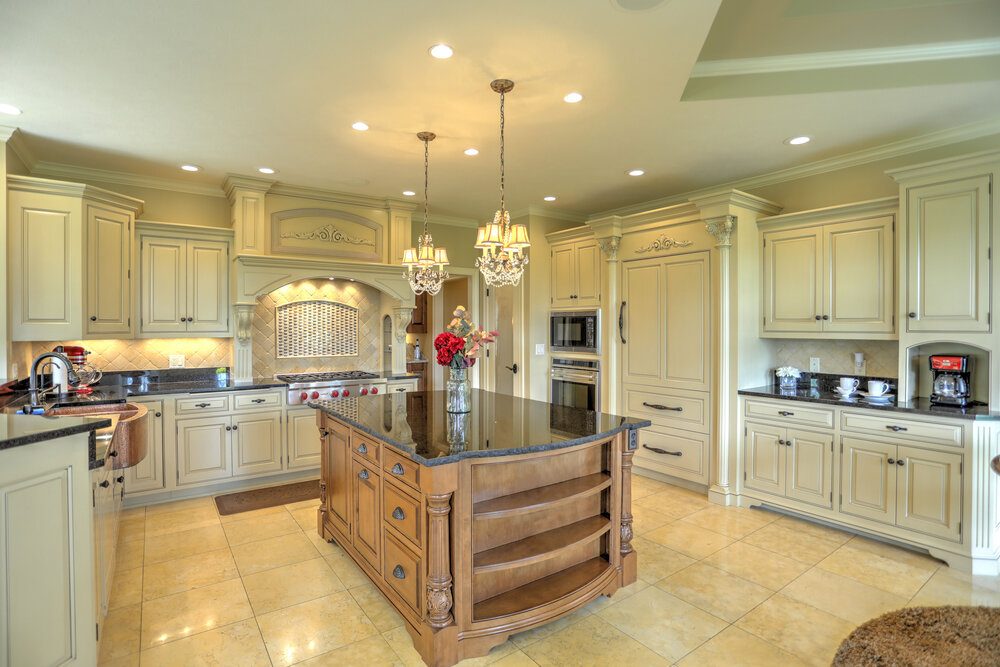 Kitchen with granite island and custom cabinetry